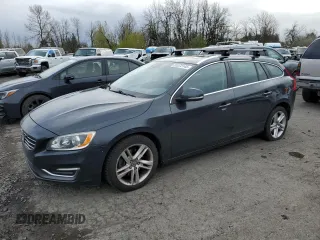 2015 Volvo V60 T5 Drive-E Premier z VIN YV140MEB2F1207148, wystawiony jako Copart lot #51272145 z przebiegiem 114 374 mil mil oraz Szkody całkowita. Historia ofert i sprzedaży dostępna na DreamBid. Obrazek 1.