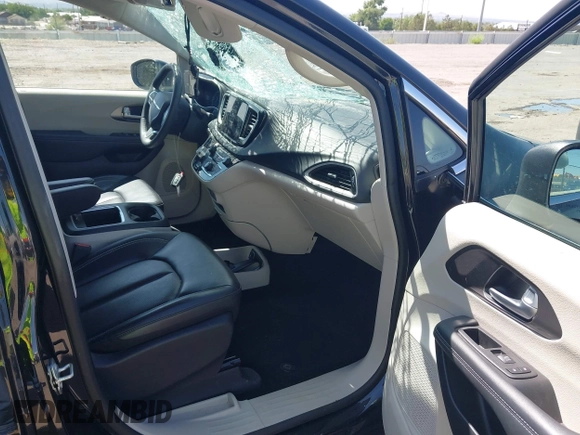 2023 Chrysler Pacifica Touring L with VIN 2C4RC1BG9PR628170, listed as a IAAI auction lot 42515590 with 41,987 mi miles and . Bid and sale history available at DreamBid. Image 5.