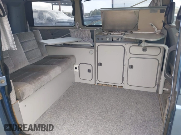 1989 Volkswagen Vanagon with VIN WV2YB0252KH059286, listed as a IAAI auction lot 42137080 with 130,604 mi miles and . Bid and sale history available at DreamBid. Image 8.