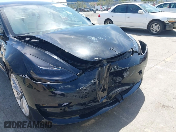2019 Tesla Model 3 Long Range with VIN 5YJ3E1EB6KF192477, listed as a IAAI auction lot 41981600 with 62,888 mi miles. Bid and sale history available at carsss.com. Image 6.