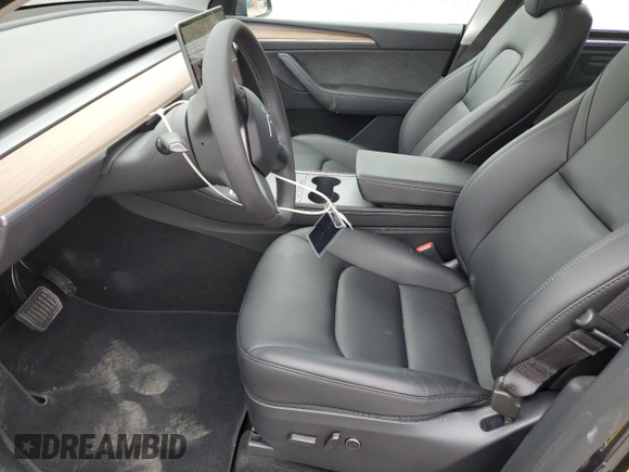 2024 Tesla Model Y Long Range with VIN 7SAYGDEE9RF069801, listed as a Copart auction lot 60857145 with 18,808 mi miles and Salvage title. Bid and sale history available at DreamBid. Image 7.