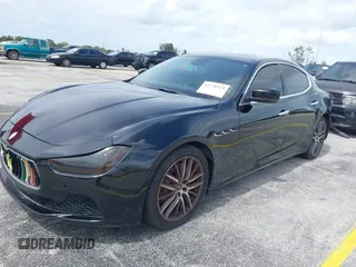 2015 Maserati Ghibli with VIN ZAM57XSA1F1144073, listed as a IAAI auction lot 42770723 with 105,782 mi miles and . Bid and sale history available at DreamBid. Image 2.