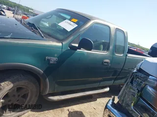 1999 Ford F-150 XL z VIN 2FTRX18L9XCA01139, wystawiony jako IAAI lot #42550053 z przebiegiem 263 950 mil mil oraz . Historia ofert i sprzedaży dostępna na DreamBid. Obrazek 14.
