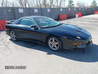 1997 Pontiac Firebird Trans Am with VIN 2G2FV22P7V2215905, listed as a IAAI auction lot 41764996 with 112,368 mi miles. Bid and sale history available at carsss.com. Image 1.