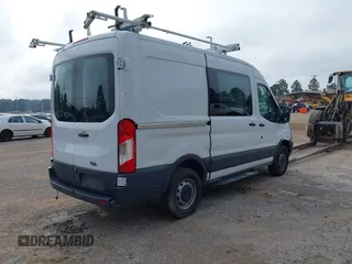 2015 Ford Transit Cargo with VIN 1FTNR1CM2FKB29029, listed as a IAAI auction lot 42286089 with 130,845 mi miles and . Bid and sale history available at DreamBid. Image 4.