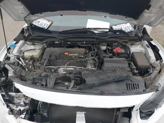 2020 Honda Civic LX with VIN 2HGFC2F64LH593100, listed as a IAAI auction lot 41877572 with 76,713 mi miles and . Bid and sale history available at DreamBid. Image 10.