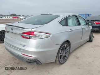 2019 Ford Fusion Titanium with VIN 3FA6P0D9XKR206465, listed as a IAAI auction lot 41577306 with 70,668 mi miles. Bid and sale history available at carsss.com. Image 4.