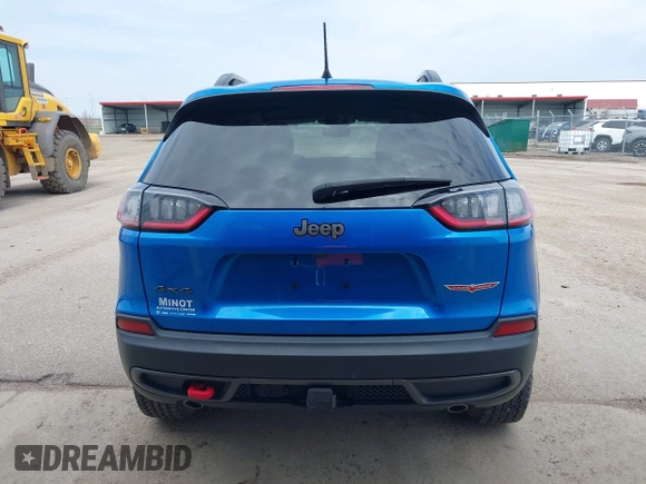 2022 Jeep Cherokee Trailhawk z VIN 1C4PJMBX4ND513488, wystawiony jako IAAI lot #42137114 z przebiegiem 12 306 mil mil oraz . Historia ofert i sprzedaży dostępna na DreamBid. Obrazek 16.