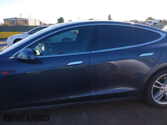 2015 Tesla Model S 85D with VIN 5YJSA1E28FF110066, listed as a IAAI auction lot 40672973 with 100,157 mi miles. Bid and sale history available at carsss.com. Image 15.