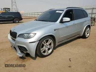 2011 BMW X5 M with VIN 5YMGY0C58BLK26357, listed as a Copart auction lot 71443774 with 116,973 mi miles and Salvage Title. Bid and sale history available at carsss.com. Image 1.