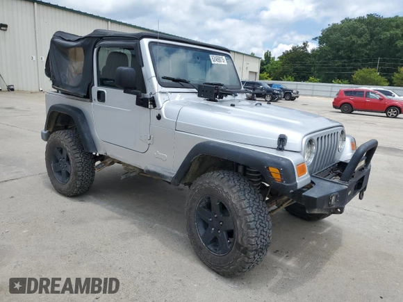 2005 Jeep Wrangler X with VIN 1J4FA39S55P353789, listed as a Copart auction lot 62469015 with 143,817 mi miles and Salvage title. Bid and sale history available at DreamBid. Image 4.