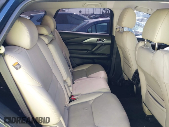 2021 Mazda CX-9 Touring with VIN JM3TCACY9M0526880, listed as a IAAI auction lot 42310923 with 25,991 mi miles and . Bid and sale history available at DreamBid. Image 8.
