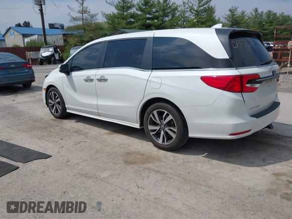 2021 Honda Odyssey Touring with VIN 5FNRL6H80MB010952, listed as a IAAI auction lot 42080412 with 90,594 mi miles and . Bid and sale history available at DreamBid. Image 3.