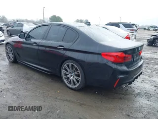 2018 BMW 5 Series M550i xDrive with VIN WBAJB9C59JB049114, listed as a IAAI auction lot 41543633 with 87,942 mi miles and . Bid and sale history available at carsss.com. Image 3.