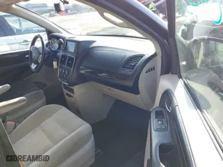 2014 Dodge Grand Caravan SXT with VIN 2C4RDGBG7ER197065, listed as a IAAI auction lot 41674441 with 233,065 mi miles. Bid and sale history available at carsss.com. Image 5.
