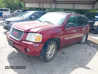 2006 GMC Envoy SLE z VIN 1GKDS13S362314323, wystawiony jako IAAI lot #42476958 z przebiegiem 164 322 mil mil oraz . Historia ofert i sprzedaży dostępna na DreamBid. Obrazek 2.