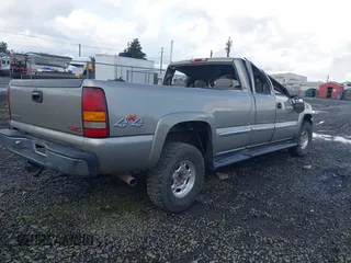 2000 GMC Sierra 2500 SLE z VIN 1GTGK29U7YE380284, wystawiony jako IAAI lot #41965443 z przebiegiem 189 831 mil mil oraz . Historia ofert i sprzedaży dostępna na DreamBid. Obrazek 4.