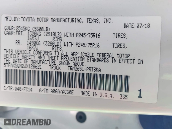 2018 Toyota Tacoma SR with VIN 5TFAX5GN2JX128621, listed as a IAAI auction lot 41797514 with 216,251 mi miles and . Bid and sale history available at DreamBid. Image 9.
