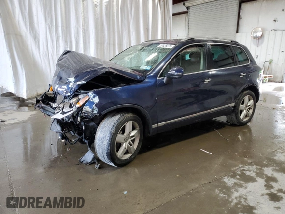 2014 Volkswagen Touareg Sport with VIN WVGEF9BP2ED002718, listed as a Copart auction lot 59526575 with 194,480 mi miles and Non repairable. Bid and sale history available at DreamBid. Image 1.