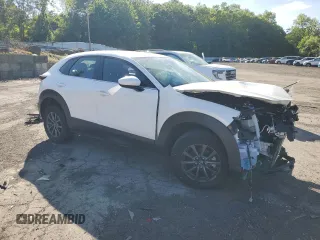 2023 Mazda CX-30 S with VIN 3MVDMBAM0PM506565, listed as a Copart auction lot 57699125 with 7,345 mi miles and Salvage title. Bid and sale history available at DreamBid. Image 4.