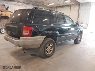 2002 Jeep Grand Cherokee Laredo with VIN 1J4GW48SX2C118434, listed as a IAAI auction lot 42036464 with 187,263 mi miles. Bid and sale history available at carsss.com. Image 4.