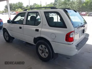 2000 Isuzu Rodeo S z VIN 4S2CK58WXY4317404, wystawiony jako IAAI lot #42261101 z przebiegiem 192 918 mil mil oraz . Historia ofert i sprzedaży dostępna na DreamBid. Obrazek 3.