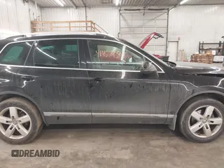 2012 Volkswagen Touareg Sport with VIN WVGEF9BP8CD009511, listed as a IAAI auction lot 41457989 with 87,325 mi miles and . Bid and sale history available at DreamBid. Image 14.