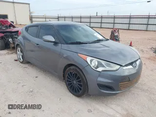 2016 Hyundai Veloster with VIN KMHTC6ADXGU277164, listed as a IAAI auction lot 41877724 with 136,690 mi miles. Bid and sale history available at carsss.com. Image 1.