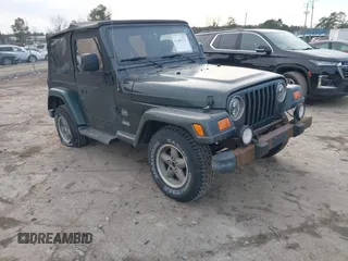 2003 Jeep Wrangler Sahara with VIN 1J4FA59SX3P344031, listed as a IAAI auction lot 41389374 with 206,407 mi miles. Bid and sale history available at carsss.com. Image 1.