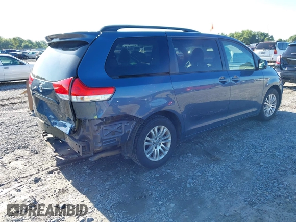 2014 Toyota Sienna XLE with VIN 5TDYK3DC9ES526117, listed as a IAAI auction lot 42247546 with 119,096 mi miles and . Bid and sale history available at DreamBid. Image 4.