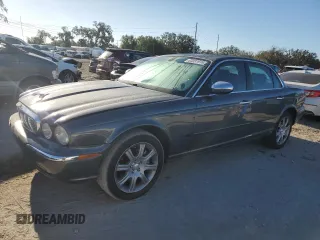 2004 Jaguar XJ VDP with VIN SAJWA74C54SG18384, listed as a Copart auction lot 83081974 with 141,664 mi miles and Salvage Title. Bid and sale history available at carsss.com. Image 1.