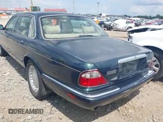 1999 Jaguar XJ with VIN SAJKD6048XC869099, listed as a IAAI auction lot 42761055 with 124,326 mi miles and . Bid and sale history available at DreamBid. Image 3.