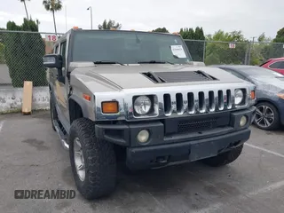 2005 Hummer H2 SUV with VIN 5GRGN23U95H129470, listed as a IAAI auction lot 42046654 with 63,489 mi miles. Bid and sale history available at carsss.com. Image 1.