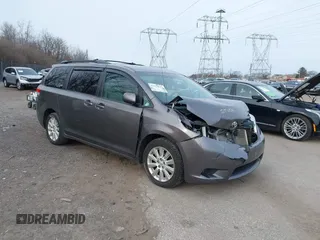 2014 Toyota Sienna LE with VIN 5TDJK3DC1ES087626, listed as a IAAI auction lot 41610813 with 142,311 mi miles. Bid and sale history available at carsss.com. Image 1.