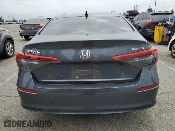 2022 Honda Civic Touring z VIN 2HGFE1F93NH314236, wystawiony jako Copart lot #53380915 z przebiegiem 25 302 mil mil oraz Szkoda całkowita • Salvage title. Historia ofert i sprzedaży dostępna na DreamBid. Obrazek 6.