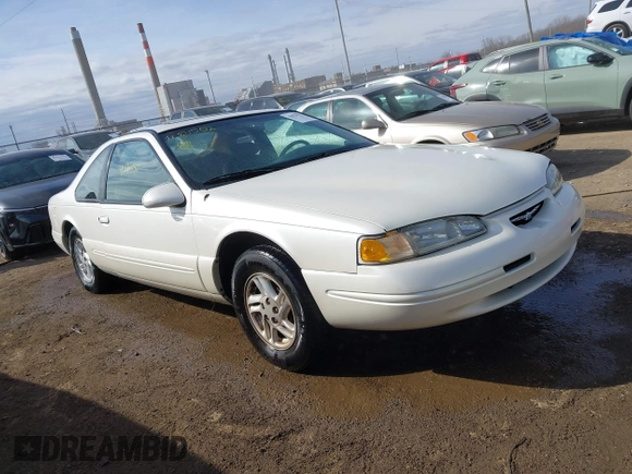 1996 Ford Thunderbird LX z VIN 1FALP6240TH131517, wystawiony jako IAAI lot #41811552 z przebiegiem 87 493 mil mil oraz . Historia ofert i sprzedaży dostępna na DreamBid. Obrazek 1.