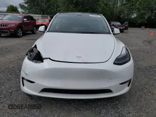2023 Tesla Model Y Long Range z VIN 7SAYGDEE3PF751019, wystawiony jako Copart lot #57972885 z przebiegiem 24 591 mil mil oraz Szkoda całkowita • Salvage title. Historia ofert i sprzedaży dostępna na DreamBid. Obrazek 5.