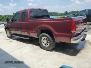 2000 Ford F-250 XL with VIN 1FTNX20L1YEB50589, listed as a Copart auction lot 63743775 with 105,448 mi miles and Salvage title. Bid and sale history available at DreamBid. Image 2.