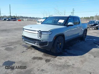 2024 Rivian R1T Adventure z VIN 7FCTGAAA5RN033799, wystawiony jako IAAI lot #41606562 z przebiegiem 9 449 mil mil oraz . Historia ofert i sprzedaży dostępna na DreamBid. Obrazek 17.