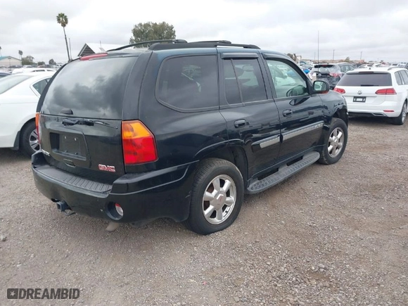 2003 GMC Envoy SLT with VIN 1GKDS13S232298062, listed as a IAAI auction lot 41668380 with 195,045 mi miles. Bid and sale history available at carsss.com. Image 4.