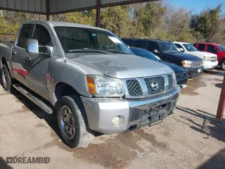 2004 Nissan Titan LE with VIN 1N6AA07BX4N537229, listed as a IAAI auction lot 41234790 with 210,475 mi miles. Bid and sale history available at carsss.com. Image 1.