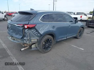 2021 Mazda CX-9 Grand Touring with VIN JM3TCADY1M0519288, listed as a IAAI auction lot 41186094 with 50,701 mi miles and . Bid and sale history available at DreamBid. Image 4.