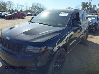 2017 Jeep Grand Cherokee SRT with VIN 1C4RJFDJ2HC696025, listed as a IAAI auction lot 41863274 with 126,949 mi miles. Bid and sale history available at carsss.com. Image 17.