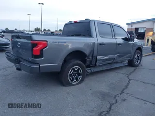 2023 Ford F-150 Lightning Pro z VIN 1FTVW1EL8PWG48559, wystawiony jako IAAI lot #41566599 z przebiegiem 8 830 mil mil oraz . Historia ofert i sprzedaży dostępna na DreamBid. Obrazek 4.