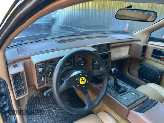 1988 Pontiac Fiero z VIN 1G2PE119XJP213392, wystawiony jako Copart lot #46803435 z przebiegiem 71 246 mil mil oraz Czysty tytuł • Clean title. Historia ofert i sprzedaży dostępna na DreamBid. Obrazek 9.