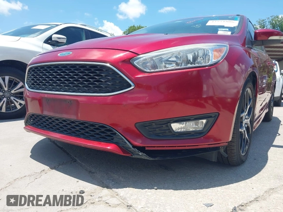 2016 Ford Focus SE z VIN 1FADP3F28GL237888, wystawiony jako IAAI lot #42564140 z przebiegiem 143 210 mil mil oraz . Historia ofert i sprzedaży dostępna na DreamBid. Obrazek 6.
