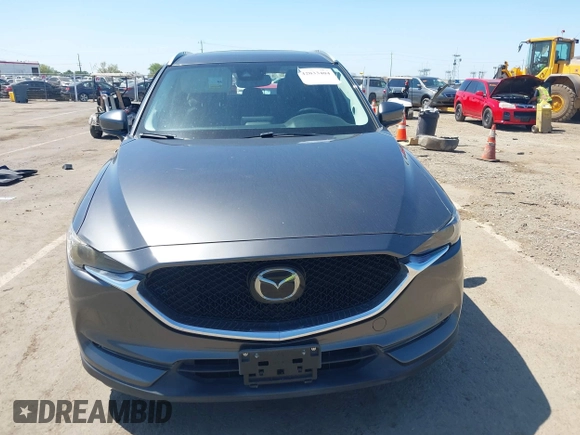 2017 Mazda CX-5 Grand Touring with VIN JM3KFADL6H0217850, listed as a IAAI auction lot 42033404 with 74,198 mi miles and . Bid and sale history available at carsss.com. Image 13.