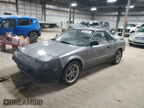 1989 Toyota MR2 z VIN JT2AW15C1K0150268, wystawiony jako Copart lot #86257134 z przebiegiem 93 969 mil mil oraz Tytuł czysty. Historia ofert i sprzedaży dostępna na DreamBid. Obrazek 1.