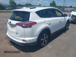 2016 Toyota RAV4 XLE with VIN JTMRFREV0GJ073114, listed as a IAAI auction lot 42548094 with 119,431 mi miles and . Bid and sale history available at DreamBid. Image 4.