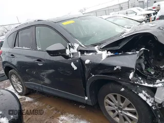 2014 Mazda CX-5 Touring with VIN JM3KE2CY2E0407453, listed as a IAAI auction lot 41564916 with 104,852 mi miles. Bid and sale history available at carsss.com. Image 12.